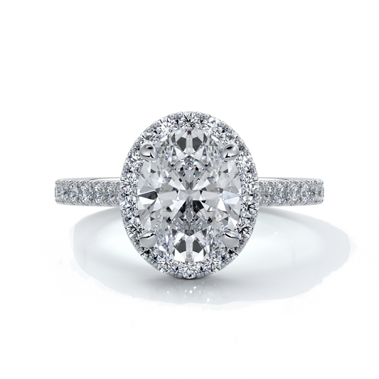 Platinum ring with a two carat oval cut diamond decorated with a scalloped set diamond halo