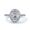 Platinum ring with a two carat oval cut diamond decorated with a scalloped set diamond halo