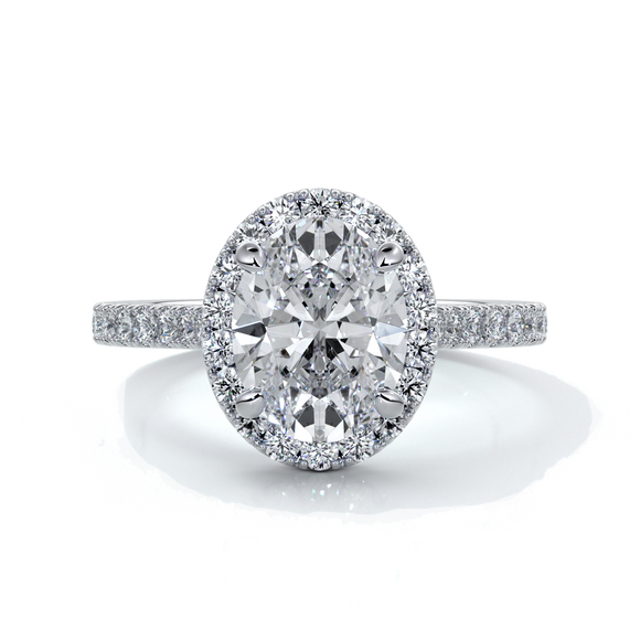 Platinum ring with a two carat oval cut diamond decorated with a scalloped set diamond halo