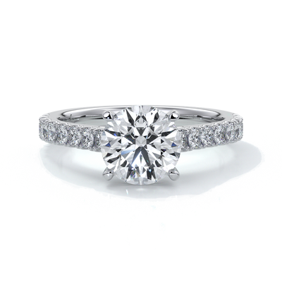 Platinum ring with round diamond secured with four claws in a cathedral setting with shoulder diamonds