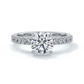 Platinum ring with round diamond and a scalloped diamond band