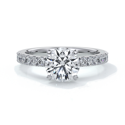 Platinum ring with round diamond and a scalloped diamond band