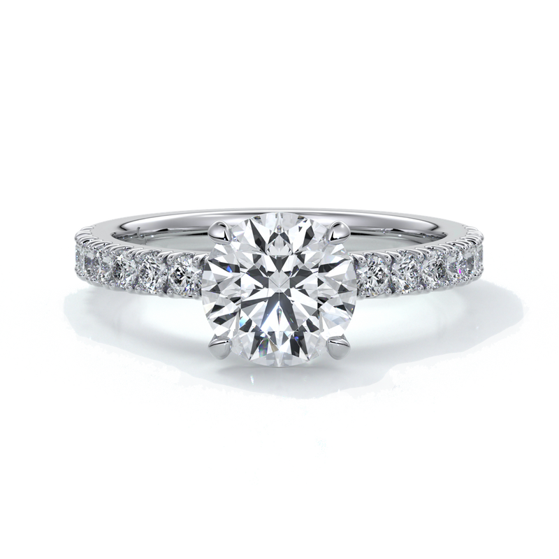 Platinum ring with round diamond and a scalloped diamond band