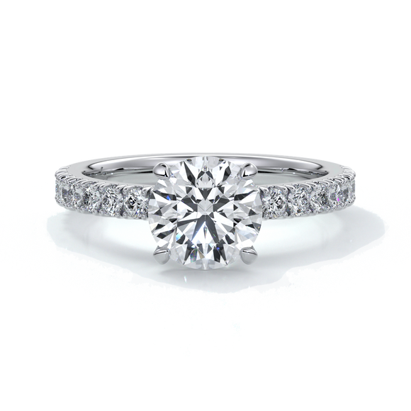 Platinum ring with round diamond and a scalloped diamond band