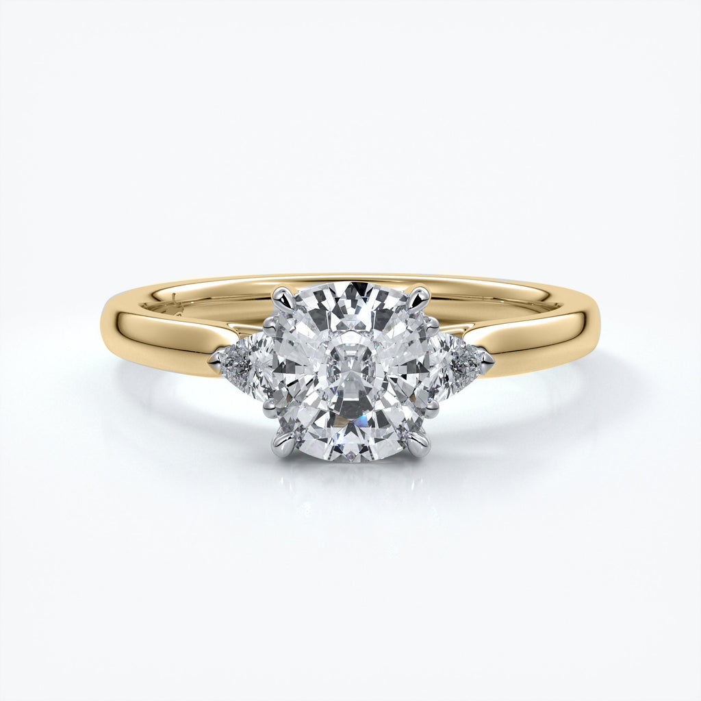 Gold diamond ring with four claws attaching diamond with two smaller diamonds on eachs side