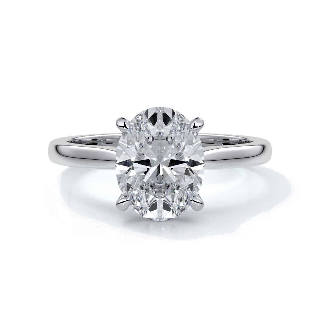 Platinum band with oval diamond secured with four claws