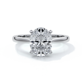 Platinum band with oval diamond secured with four claws
