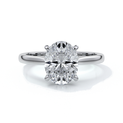 Platinum band with oval diamond secured with four claws