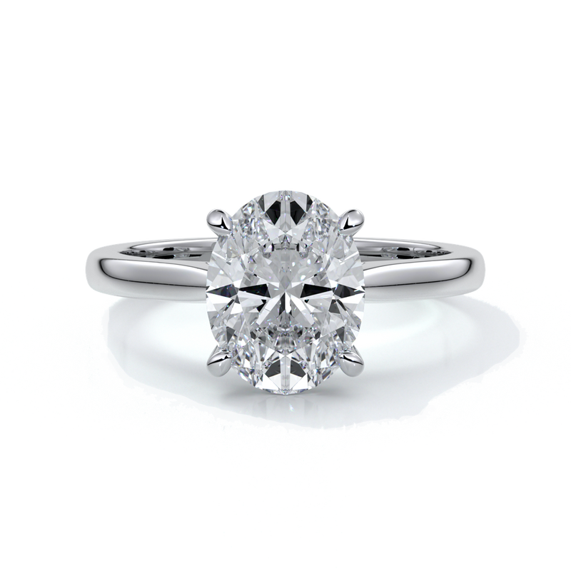 Platinum band with oval diamond secured with four claws