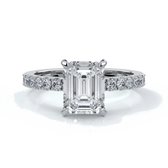 Platinum ring with a two carat emerald cut diamond secured with four claws enhanced with shoulder diamonds