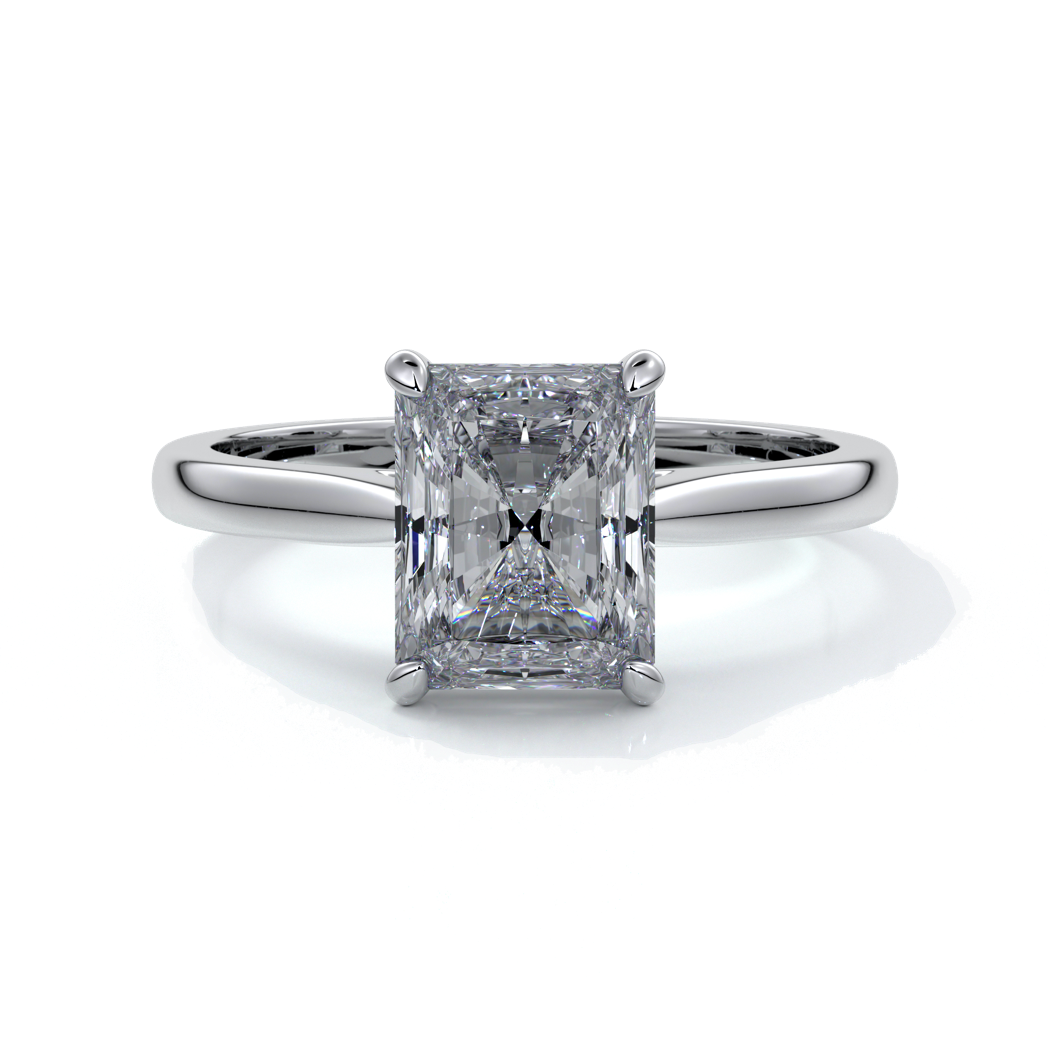Ring with two carat radiant diamond held by four claws, enhanced with eighteen carat white gold tapered band