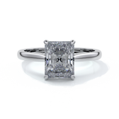 Ring with two carat radiant diamond held by four claws, enhanced with eighteen carat white gold tapered band