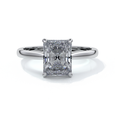 Ring with two carat radiant diamond held by four claws, enhanced with eighteen carat white gold tapered band