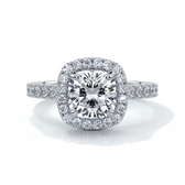 Platinum ring with a one point seven carat cushion cut diamond in a cathedral setting with a scalloped diamond band