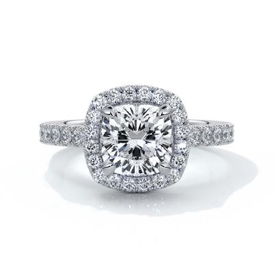 Platinum ring with a one point seven carat cushion cut diamond in a cathedral setting with a scalloped diamond band