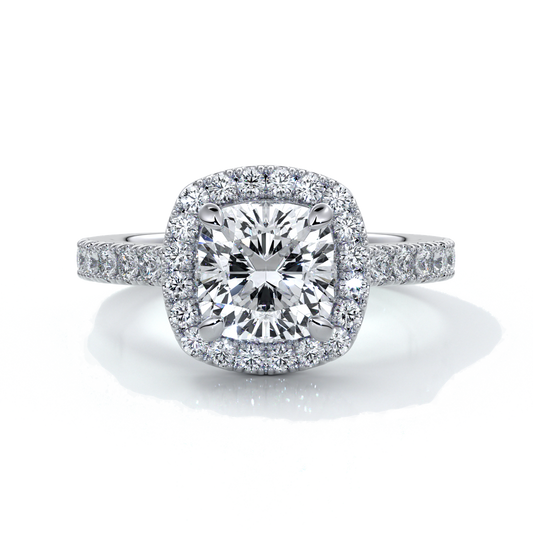 Platinum ring with a one point seven carat cushion cut diamond in a cathedral setting with a scalloped diamond band