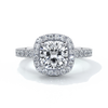 Platinum ring with a one point seven carat cushion cut diamond in a cathedral setting with a scalloped diamond band