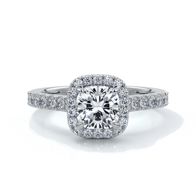 Platinum ring with one carat cushion cut diamond in a cathedral style setting with diamond detailing on the halo and shoulders