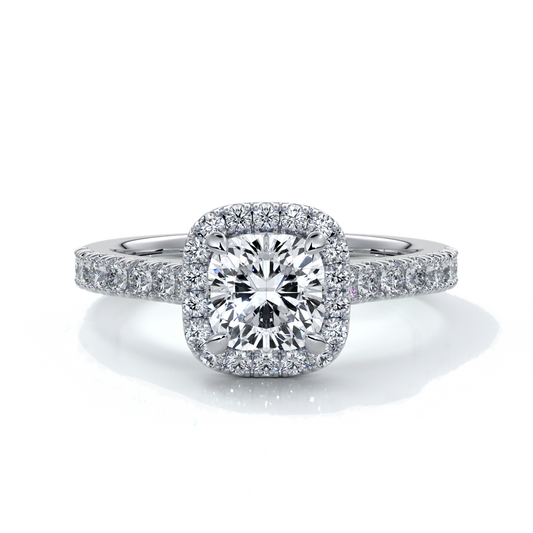 Platinum ring with one carat cushion cut diamond in a cathedral style setting with diamond detailing on the halo and shoulders