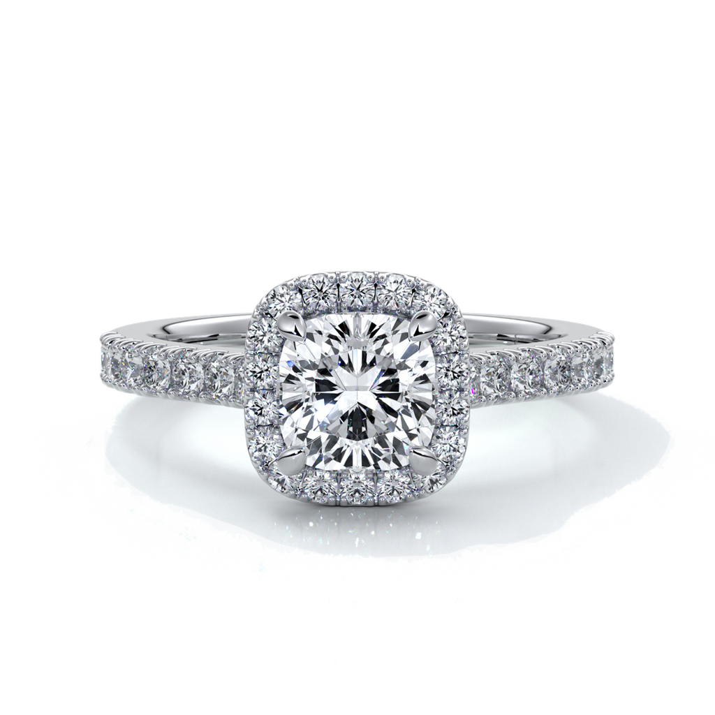 Platinum ring with one carat cushion cut diamond in a cathedral style setting with diamond detailing on the halo and shoulders