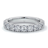 White gold women’s wedding ring with diamonds scalloped around the band.