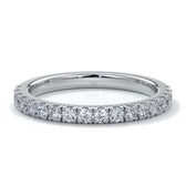 Platinum women’s wedding ring with 18mm scalloped diamonds around the band