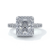Platinum ring with a two carat radiant cut diamond in a cathedral and halo setting, with shoulder diamonds