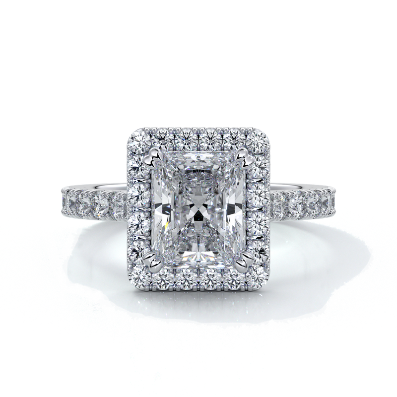Platinum ring with a two carat radiant cut diamond in a cathedral and halo setting, with shoulder diamonds