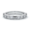 Women's wedding band with five straight baguette diamonds, complimented by six round brilliant cut diamonds in a scalloped setting