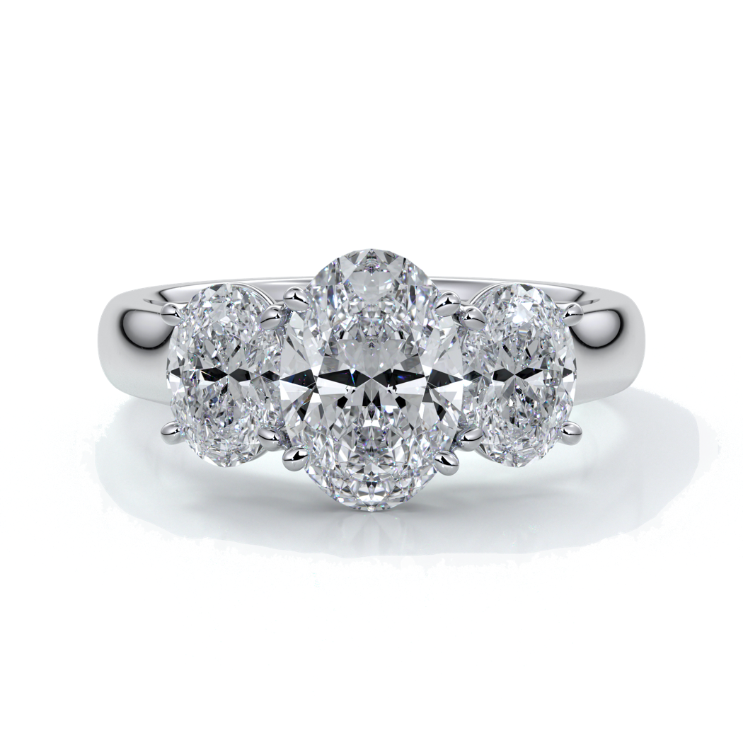 Platinum ring with oval trilogy diamond set with four claws with a cathedral setting