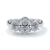 Platinum ring with oval trilogy diamond set with four claws with a cathedral setting