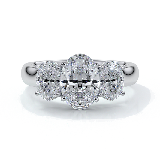 Platinum ring with oval trilogy diamond set with four claws with a cathedral setting
