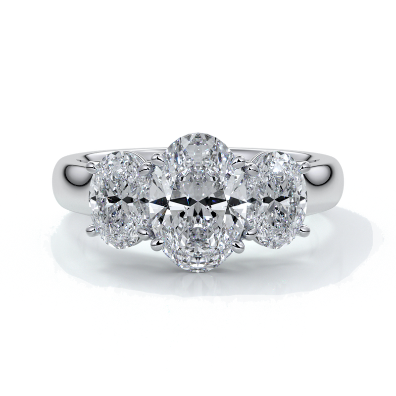 Platinum ring with oval trilogy diamond set with four claws with a cathedral setting