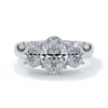 Platinum ring with oval trilogy diamond set with four claws with a cathedral setting