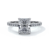 Platinum ring with a two carat radiant cut diamond enhanced in a cathedral setting with a scalloped diamond band
