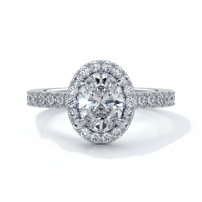 Platinum ring with one carat oval cut diamond in a cathedral style setting with scallop set shoulder diamonds and halo