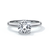 Platinum ring with a two carat cushion cut diamond secured in four claws