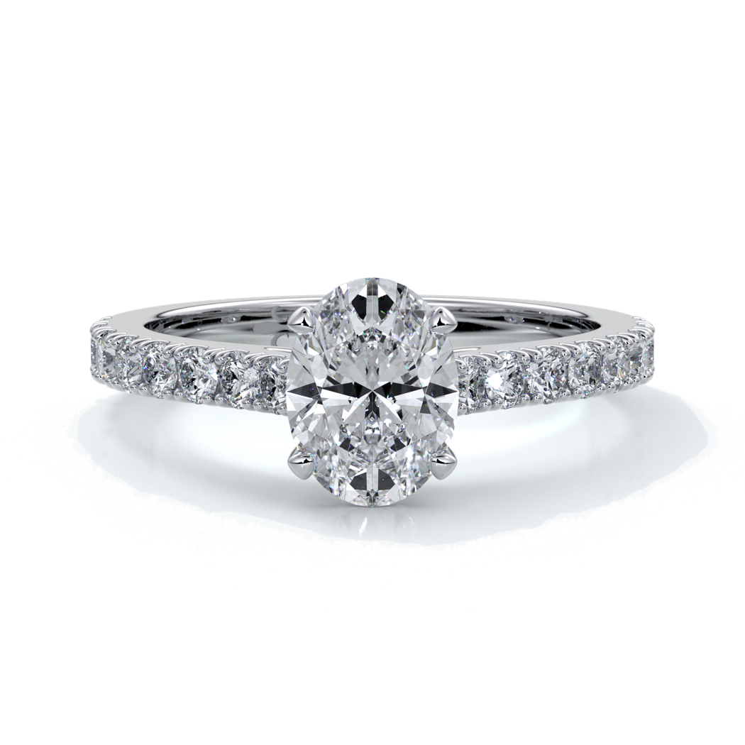 White gold ring with oval diamond secured with four claws and enhanced with cathedral setting with scalloped diamond band