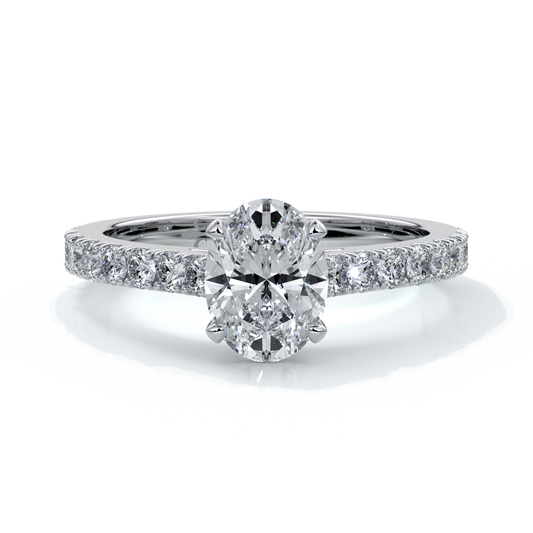 White gold ring with oval diamond secured with four claws and enhanced with cathedral setting with scalloped diamond band