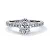 White gold ring with oval diamond secured with four claws and enhanced with cathedral setting with scalloped diamond band