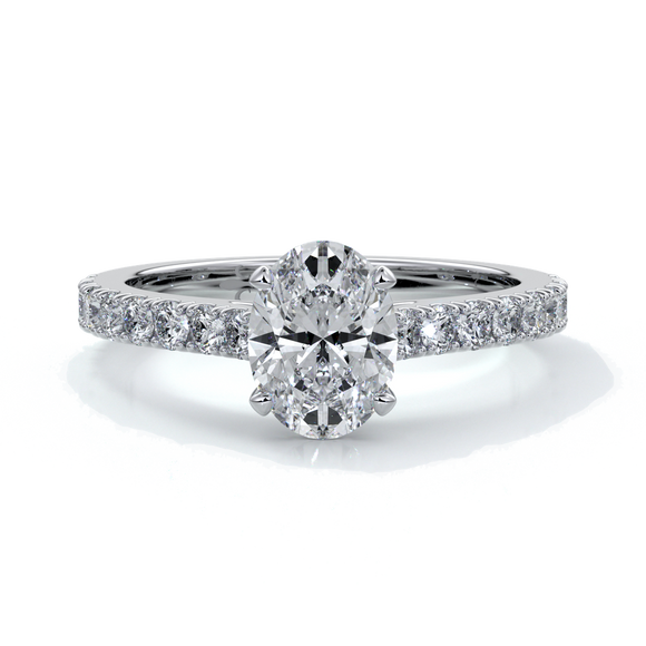 White gold ring with oval diamond secured with four claws and enhanced with cathedral setting with scalloped diamond band