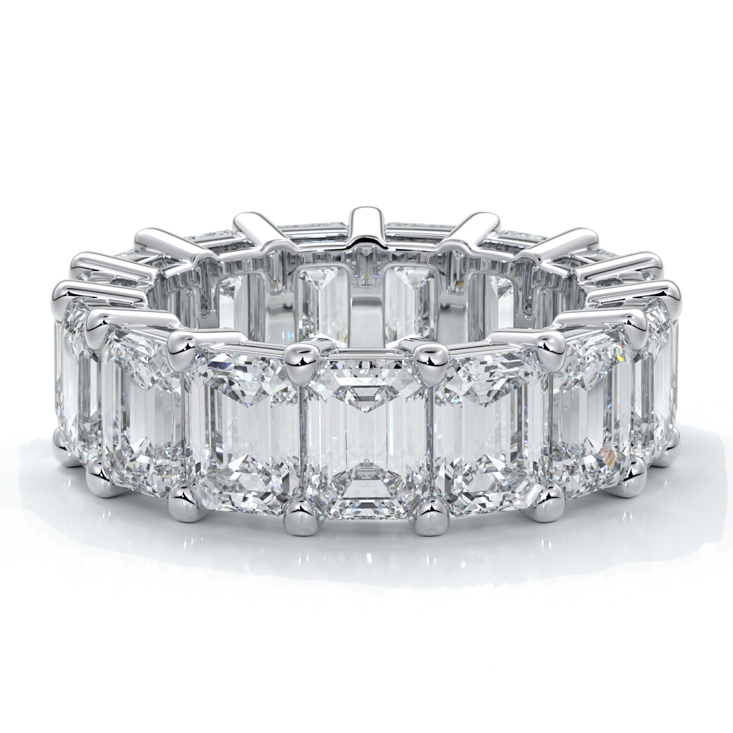 eighteen carat white gold women's wedding band with 5mm x 3.5mm Emerald cut diamonds in a scalloped setting