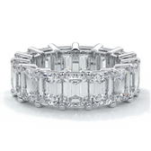 eighteen carat white gold women's wedding band with 5mm x 3.5mm Emerald cut diamonds in a scalloped setting