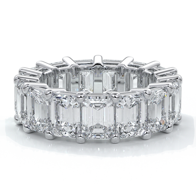 eighteen carat white gold women's wedding band with 5mm x 3.5mm Emerald cut diamonds in a scalloped setting