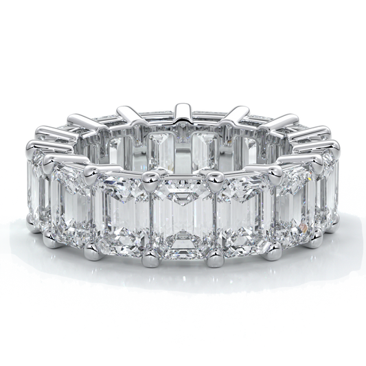 eighteen carat white gold women's wedding band with 5mm x 3.5mm Emerald cut diamonds in a scalloped setting