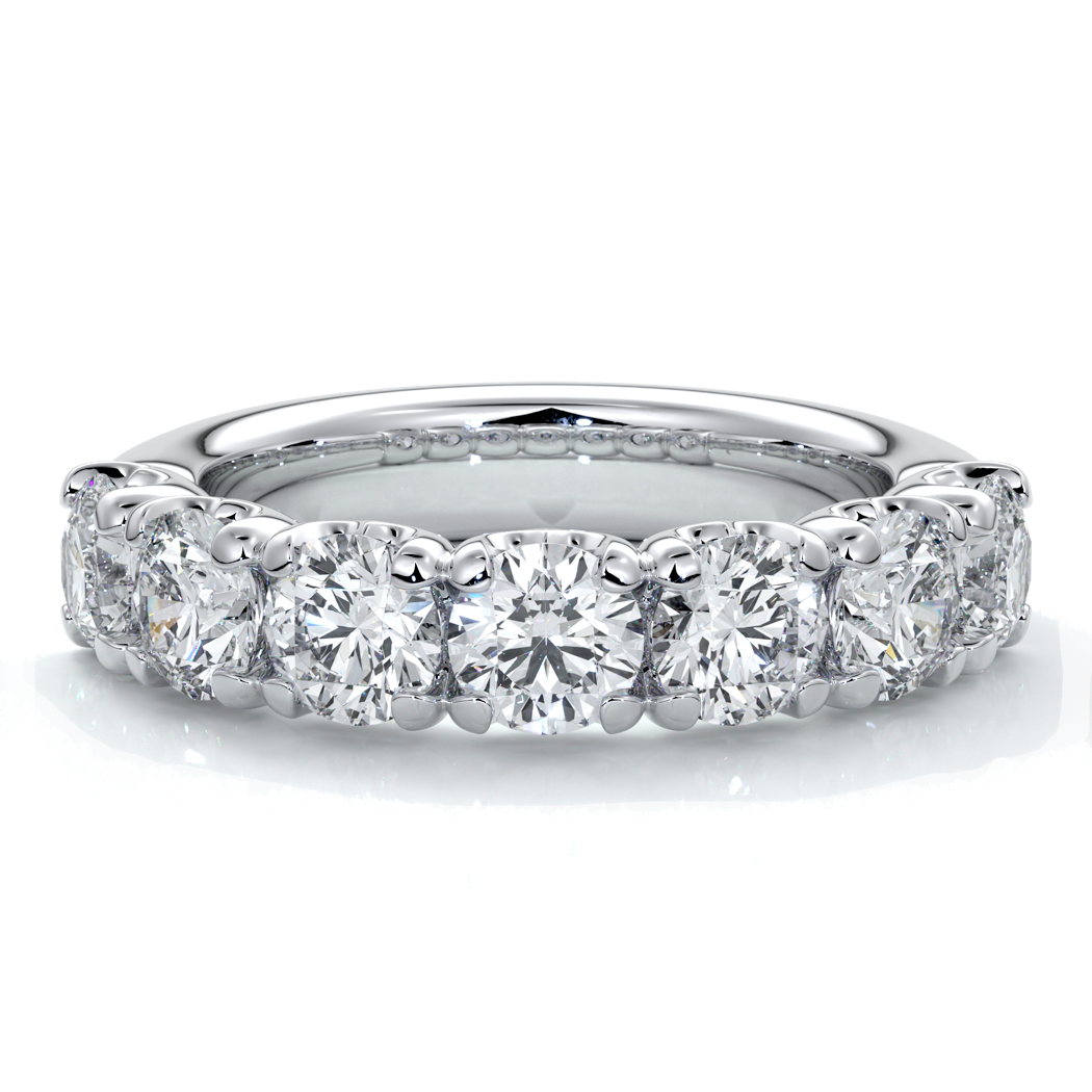 Platinum women's wedding band with 4mm round brilliant cut diamonds in a scalloped setting