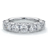 Platinum women's wedding band with 4mm round brilliant cut diamonds in a scalloped setting