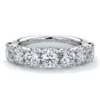 Platinum women's wedding band with 4mm round brilliant cut diamonds in a scalloped setting
