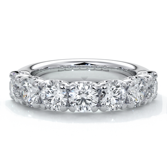Platinum women's wedding band with 4mm round brilliant cut diamonds in a scalloped setting