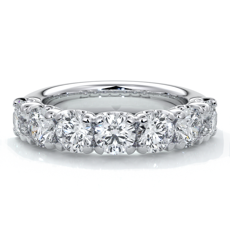 Platinum women's wedding band with 4mm round brilliant cut diamonds in a scalloped setting